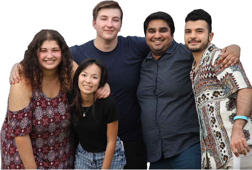 A group of five students pose for a group photo with their arms around one another's shoulders.